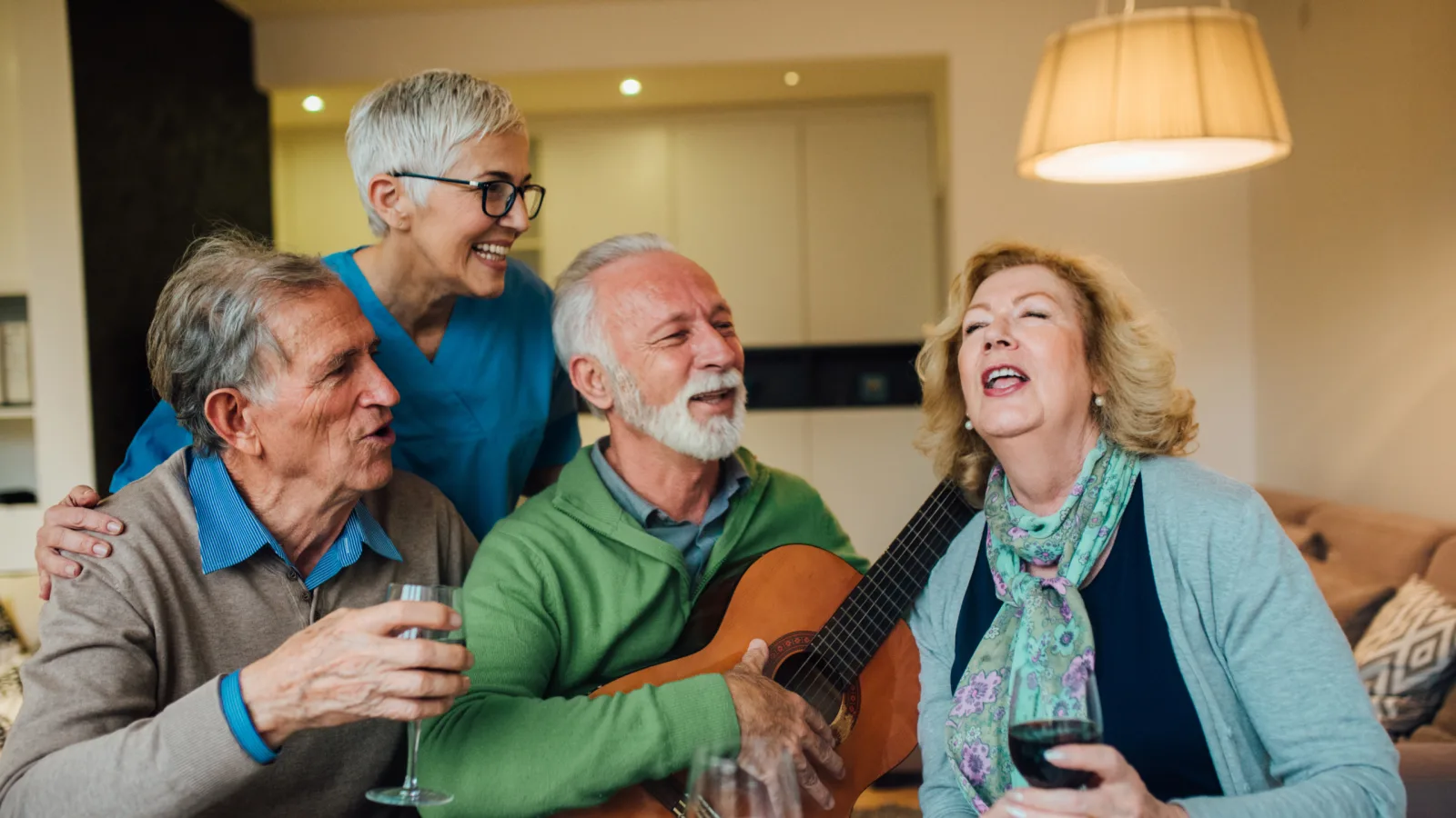 Mature friends enjoying music together in a welcoming home