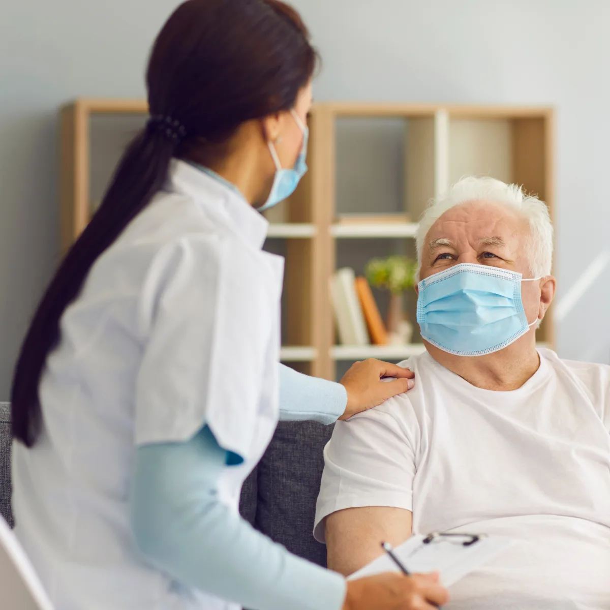 A care professional speaking with an older guest